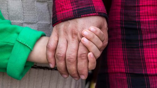 adult and child holding hands irving tx