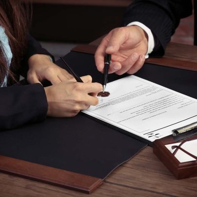 woman signing documents at desk irving tx r1t0gv1cglun5an4ynduu4foh5gk57mgu4gvjq05uo